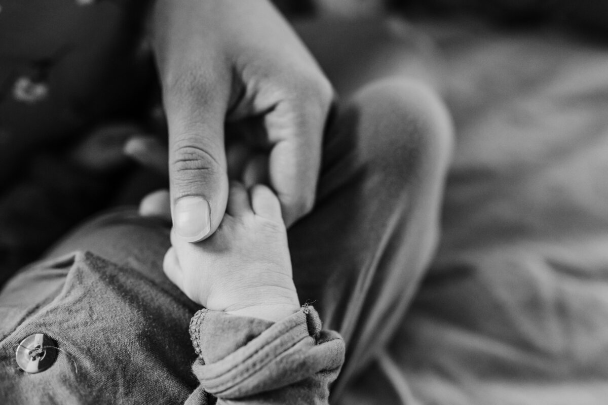 Newborn Photographer, mom's fingers reach for baby's little hands