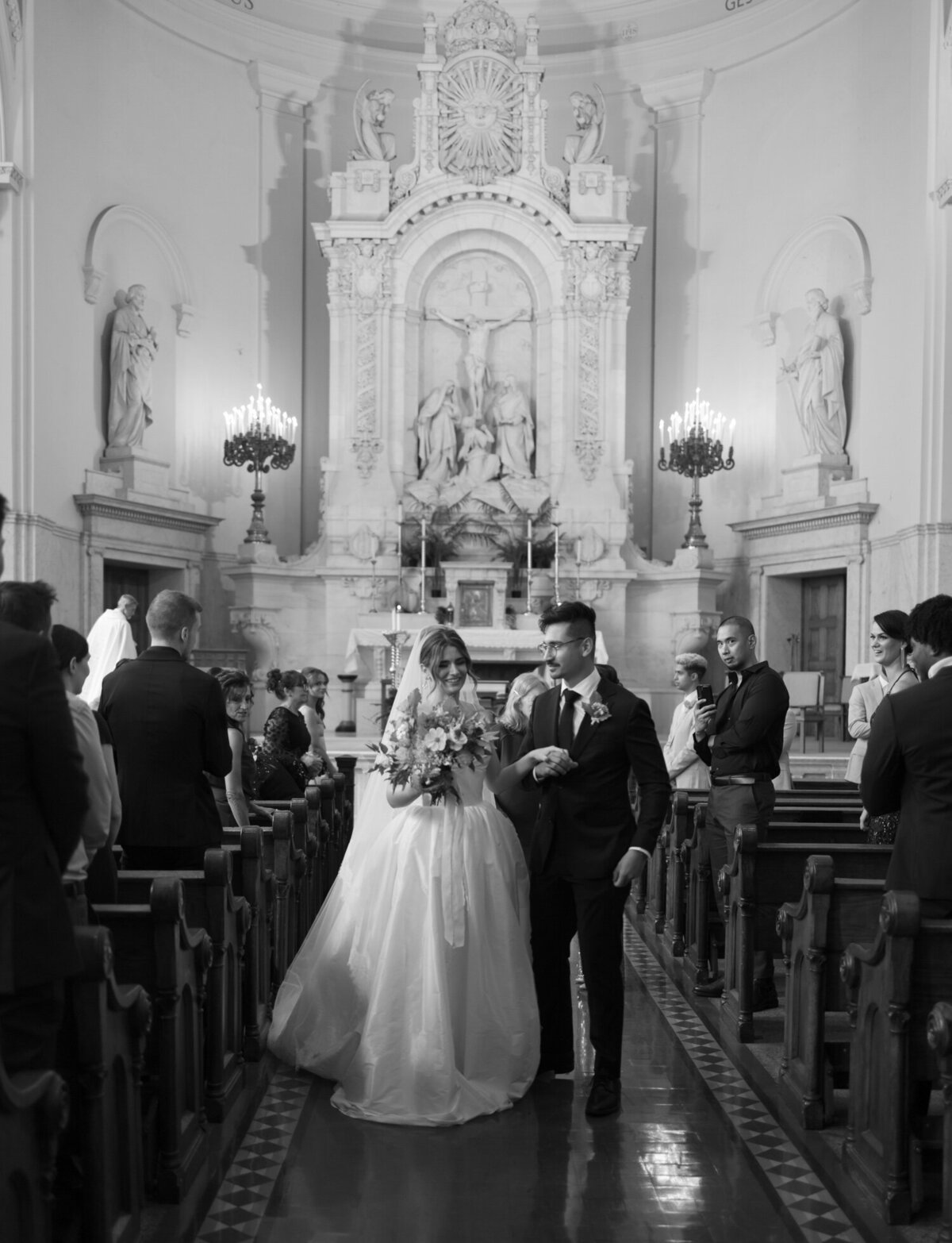 A couple embraces during their St. Peter and Paul wedding ceremony in Detroit