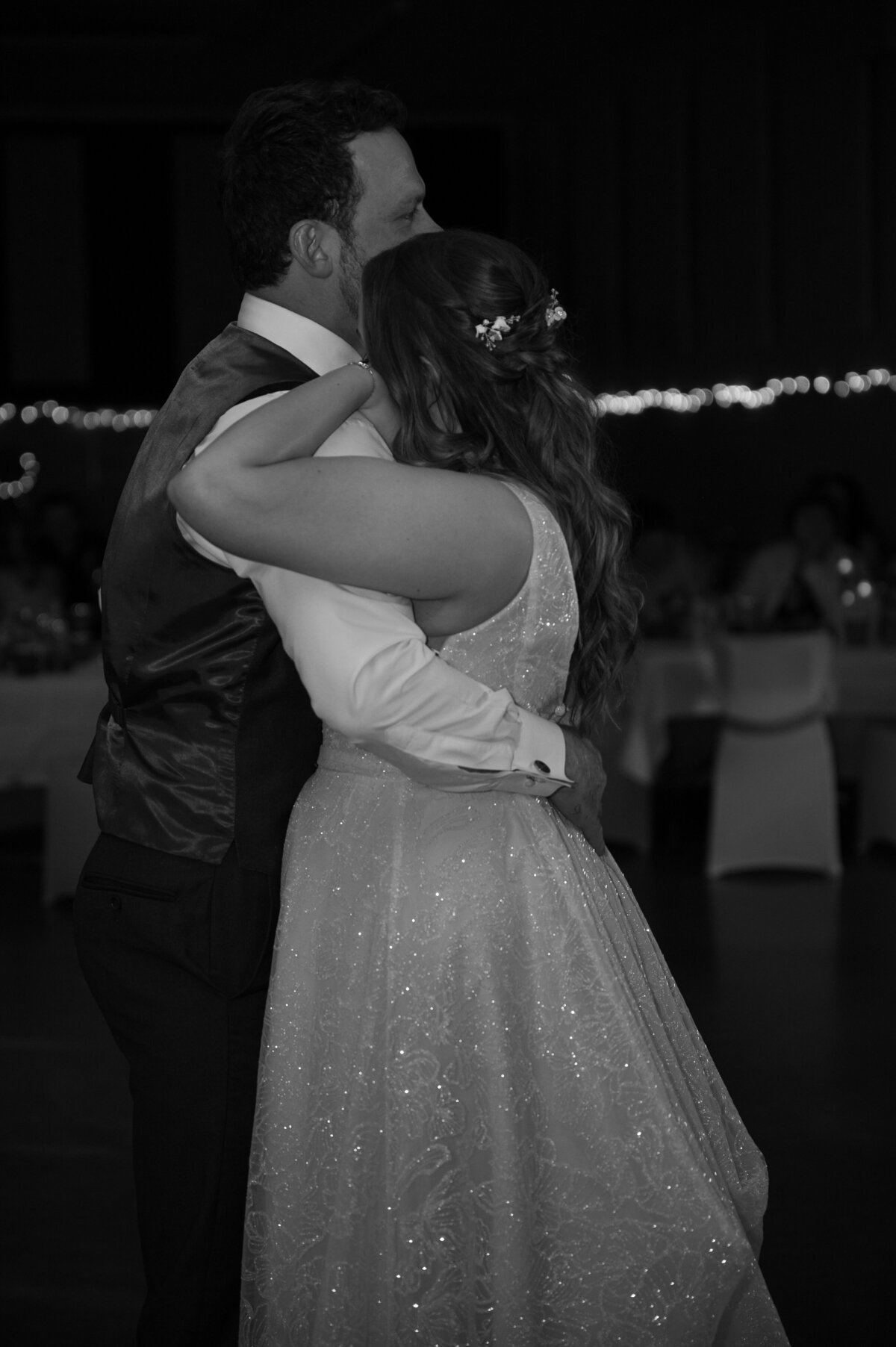 black and white photo of bride and groom during first dance