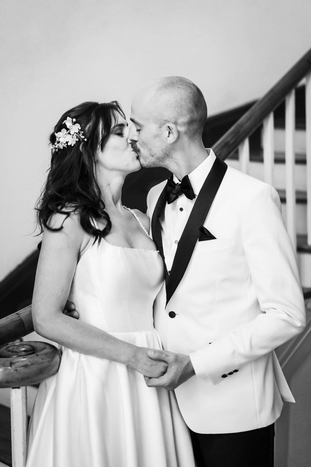 Couple kissing by stairs in Latrobe's