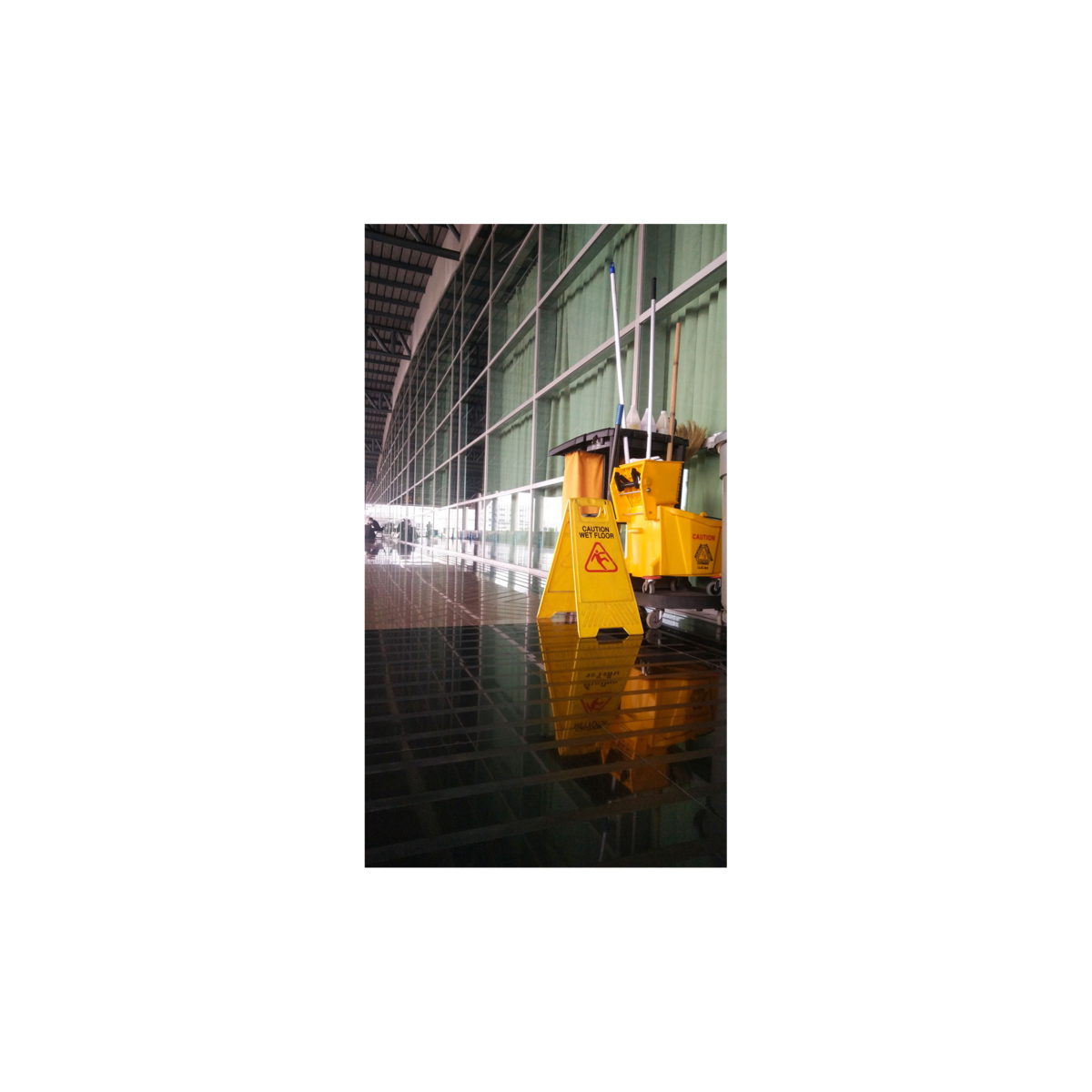 Image of cleaning cart in a hallway.