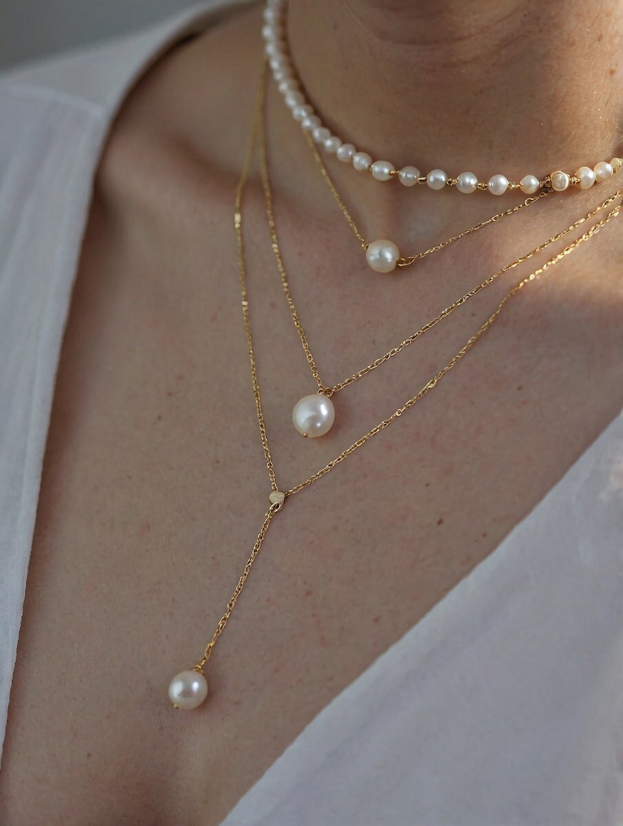 Elegant Pearl and Gold Necklaces