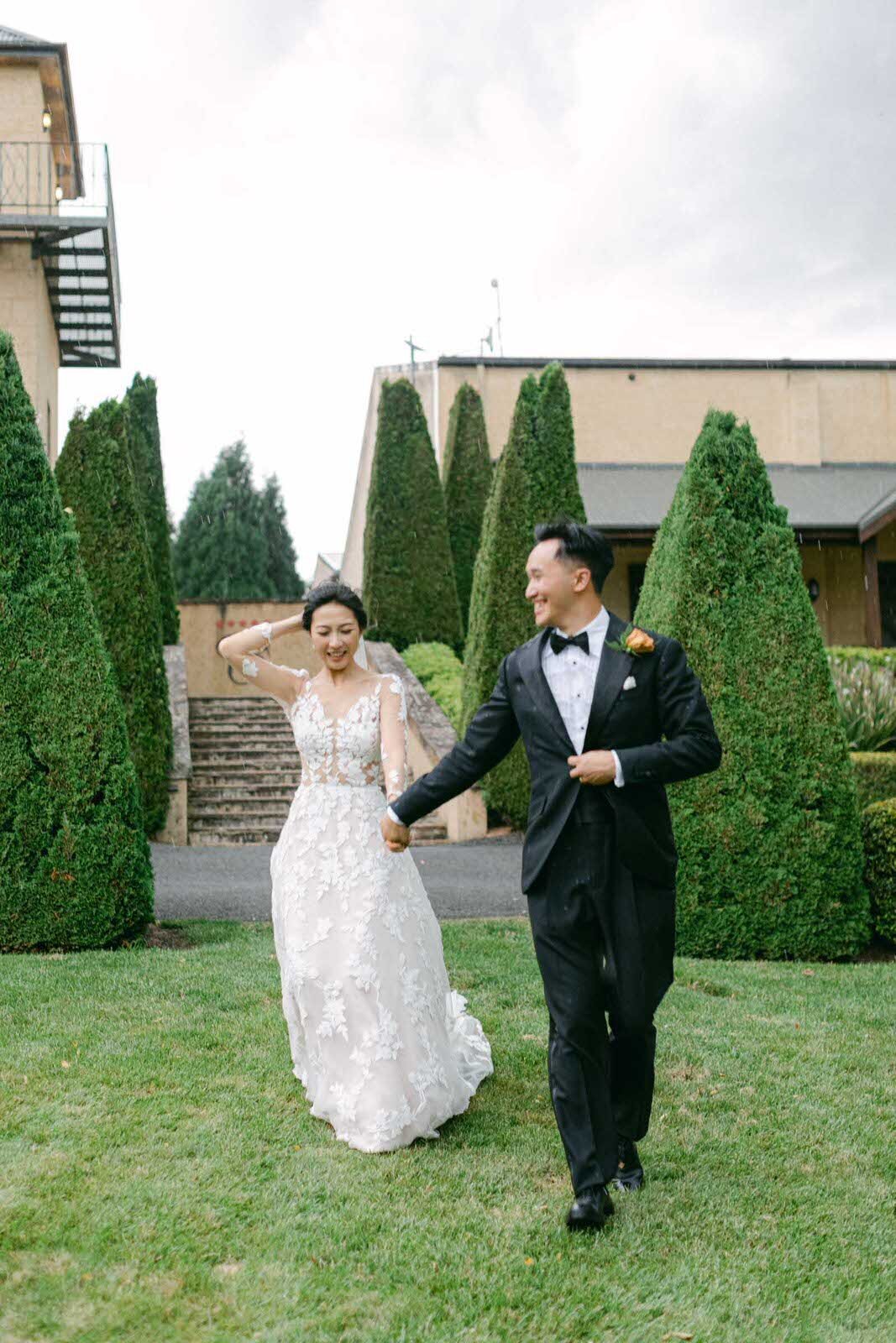 bride and groom running