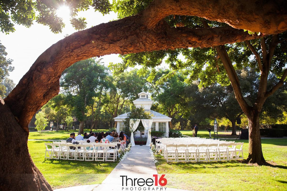 Guests are seated for a wedding ceremony at the Heritage Park in Santa Fe Springs