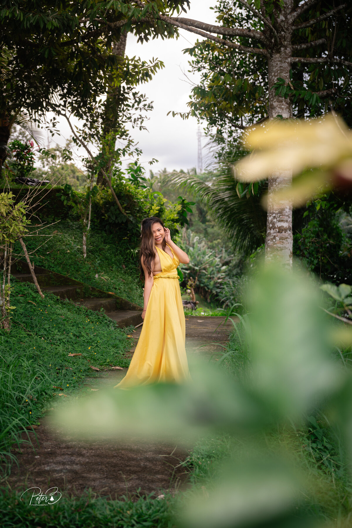 Bali Indonesia Elopement Asian Bridal portrait wearing yellow dress at Ubud swing.