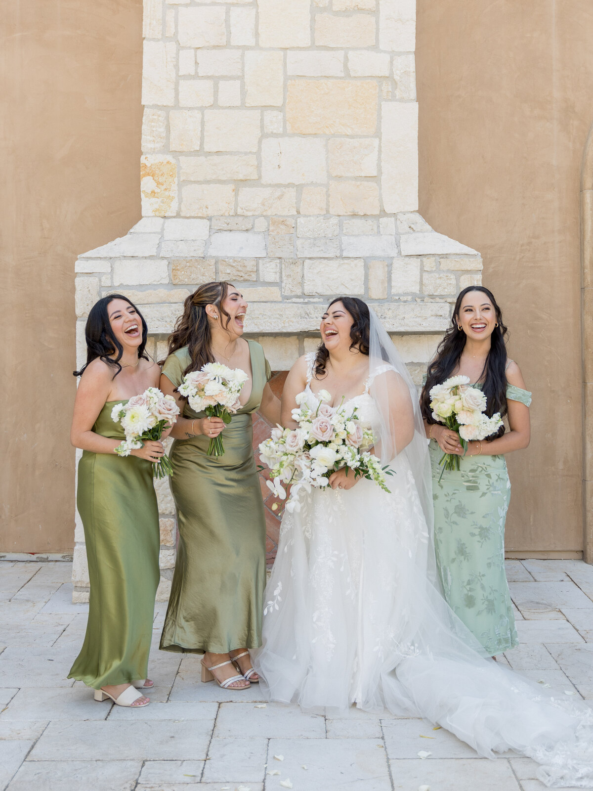 An Allegretto Vineyard wedding featuring the bride and bridesmaids by Leana Myra Photography
