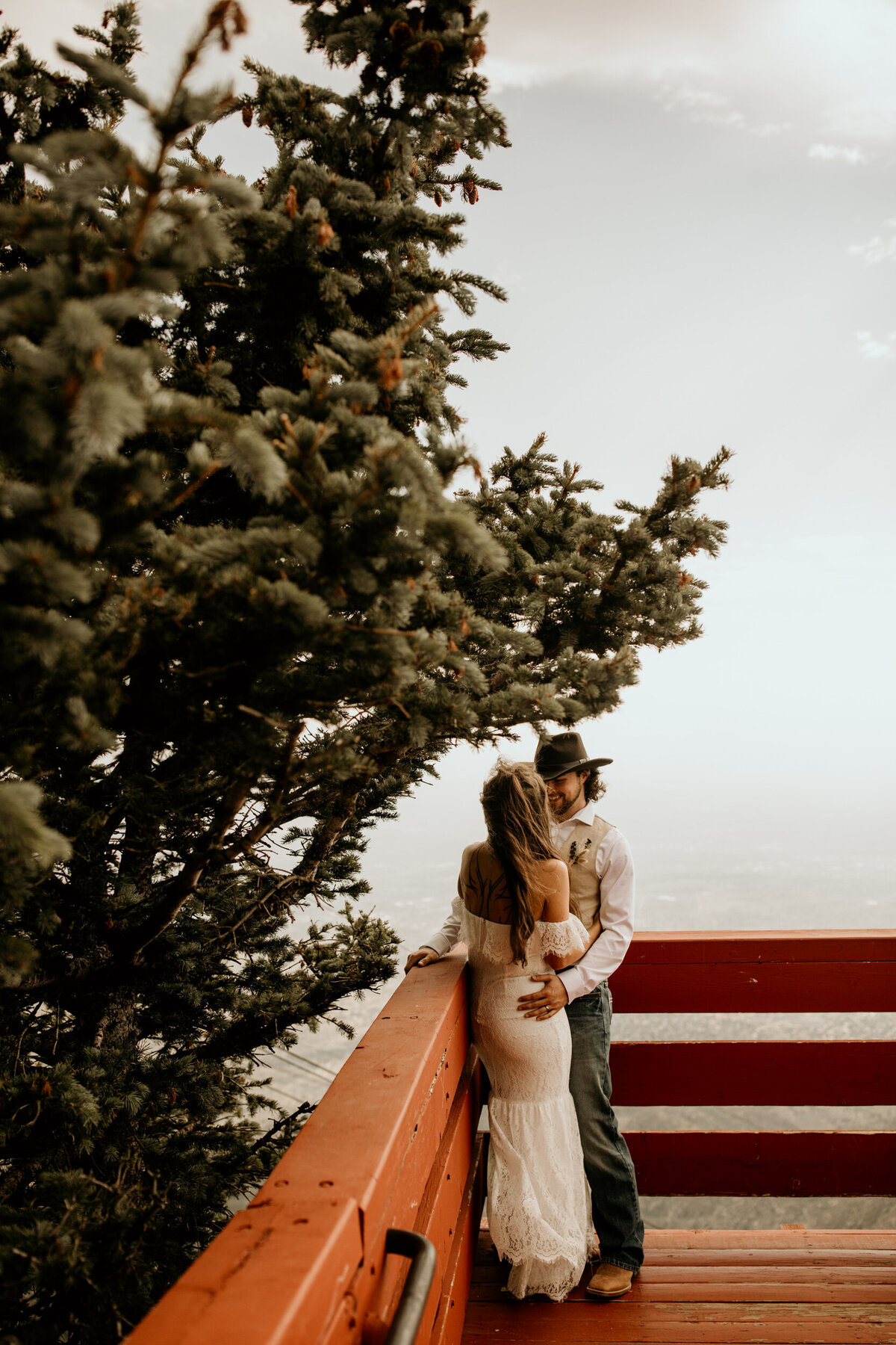 bride and groom kissing at the sandia peak tram in Albuquerque