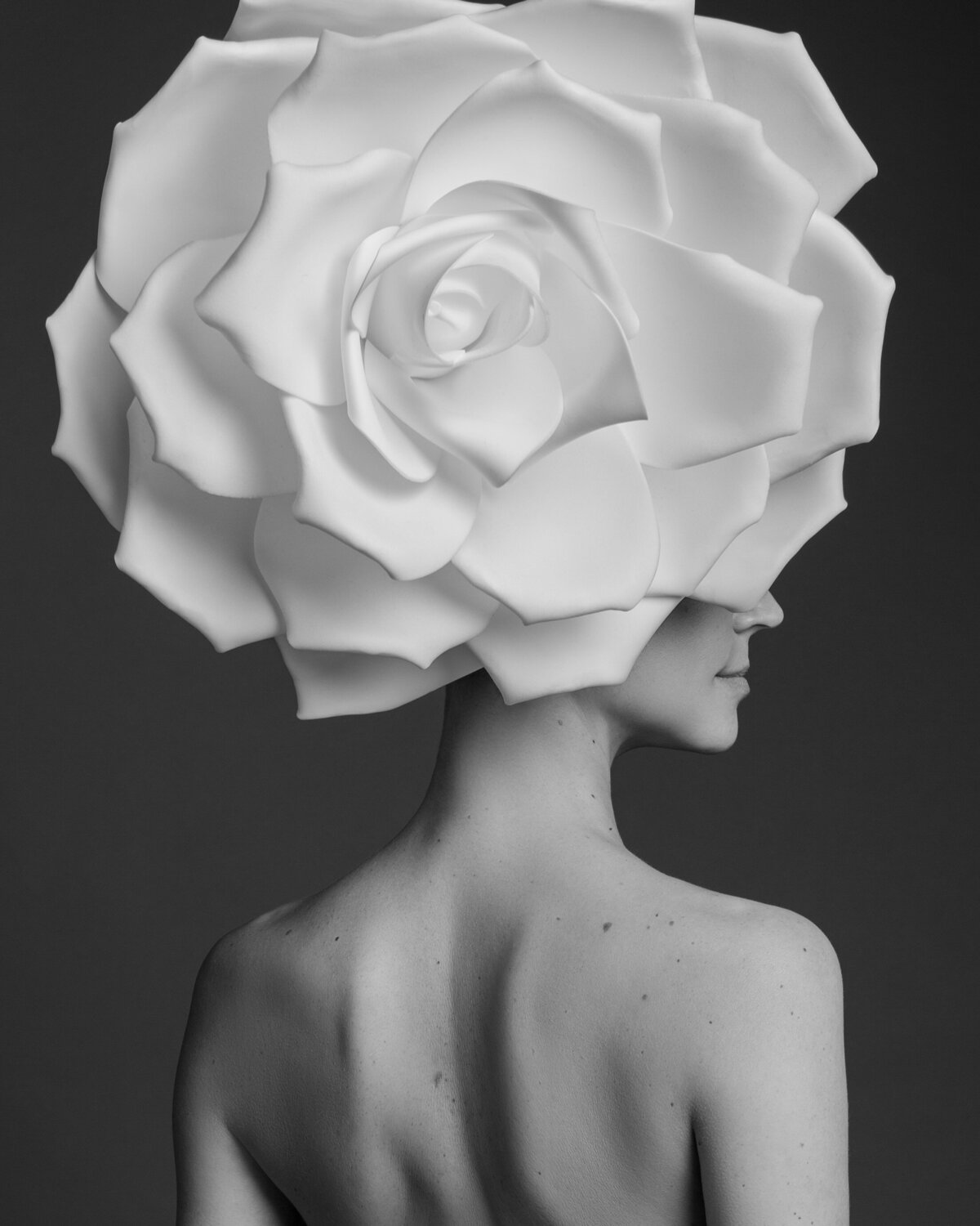 black-and-white-photo-of-woman-with-flower-by-daisy-rey-photography-in-new-jersey-and-new-york