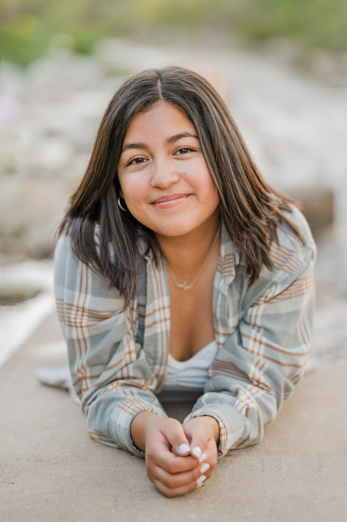 Senior Portrait of a girl laying on her stomach.