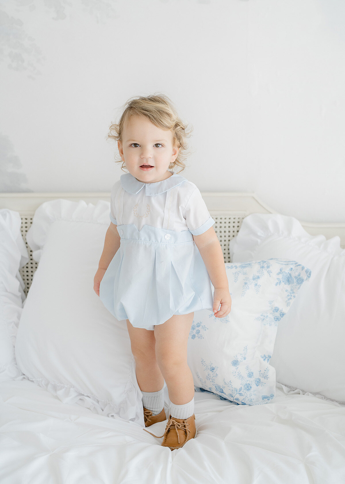 one year old boy photographed wearing feltman brothers outfit in a photo studio in st simons island