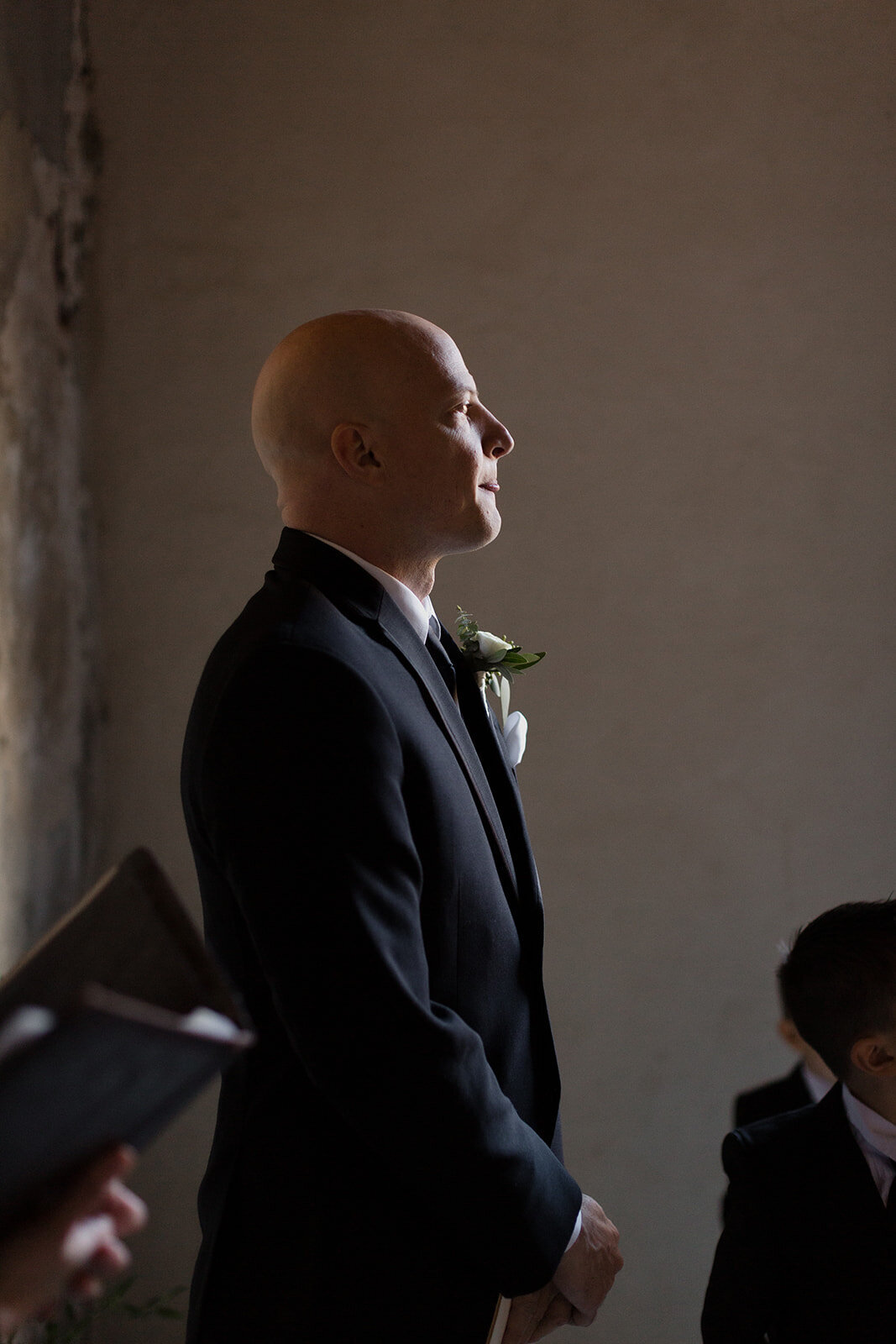 groom waits nervously for bride to walk down the aisle