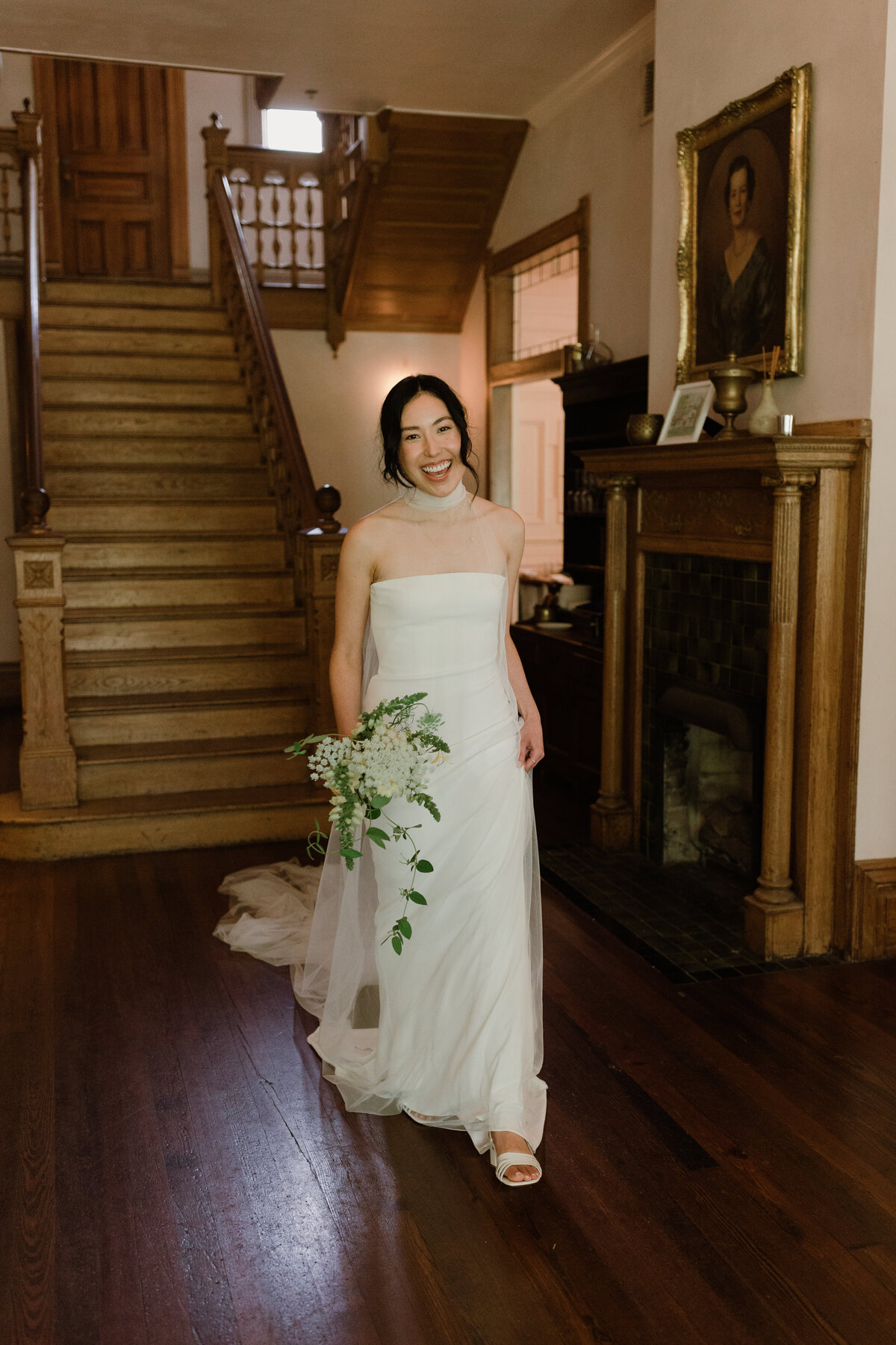 Bride standing in front of staircase at Mattie's  Austin Wedding