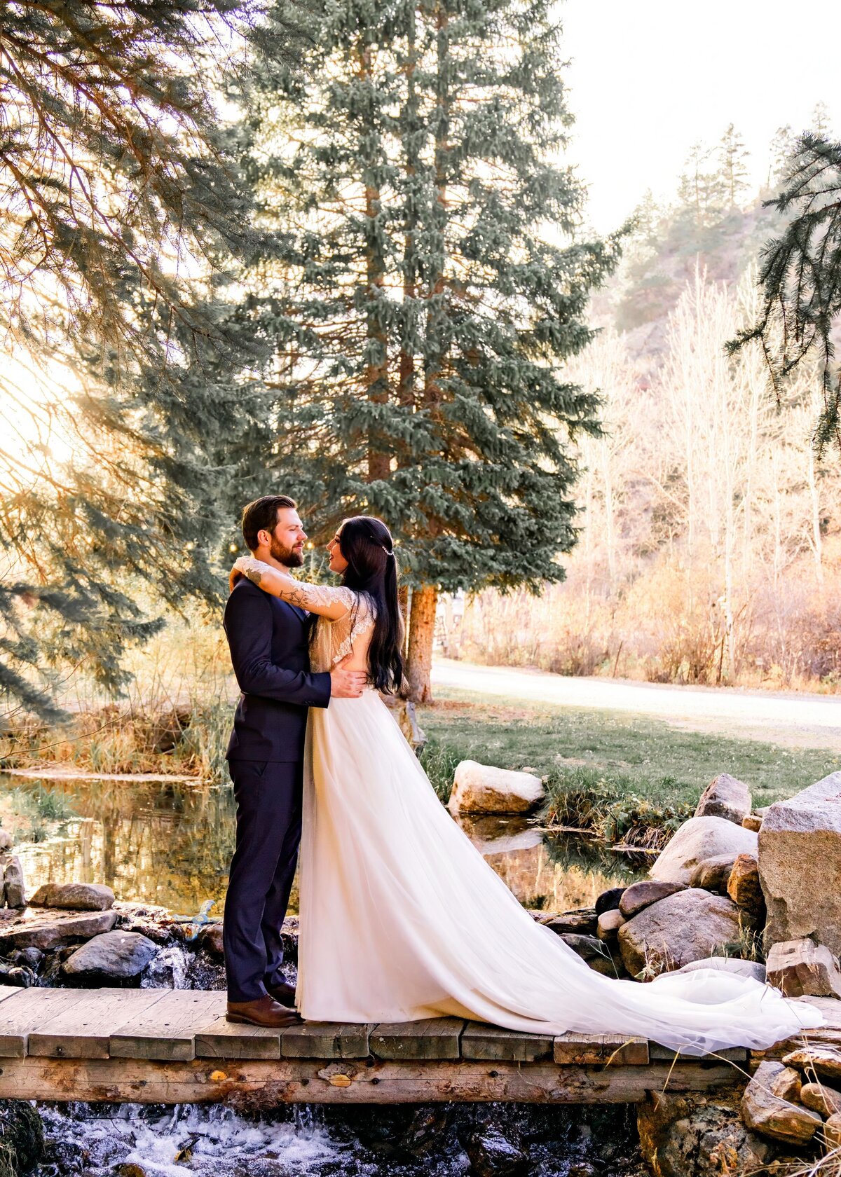 denver colorado wedding photographer - couple embracing near trees