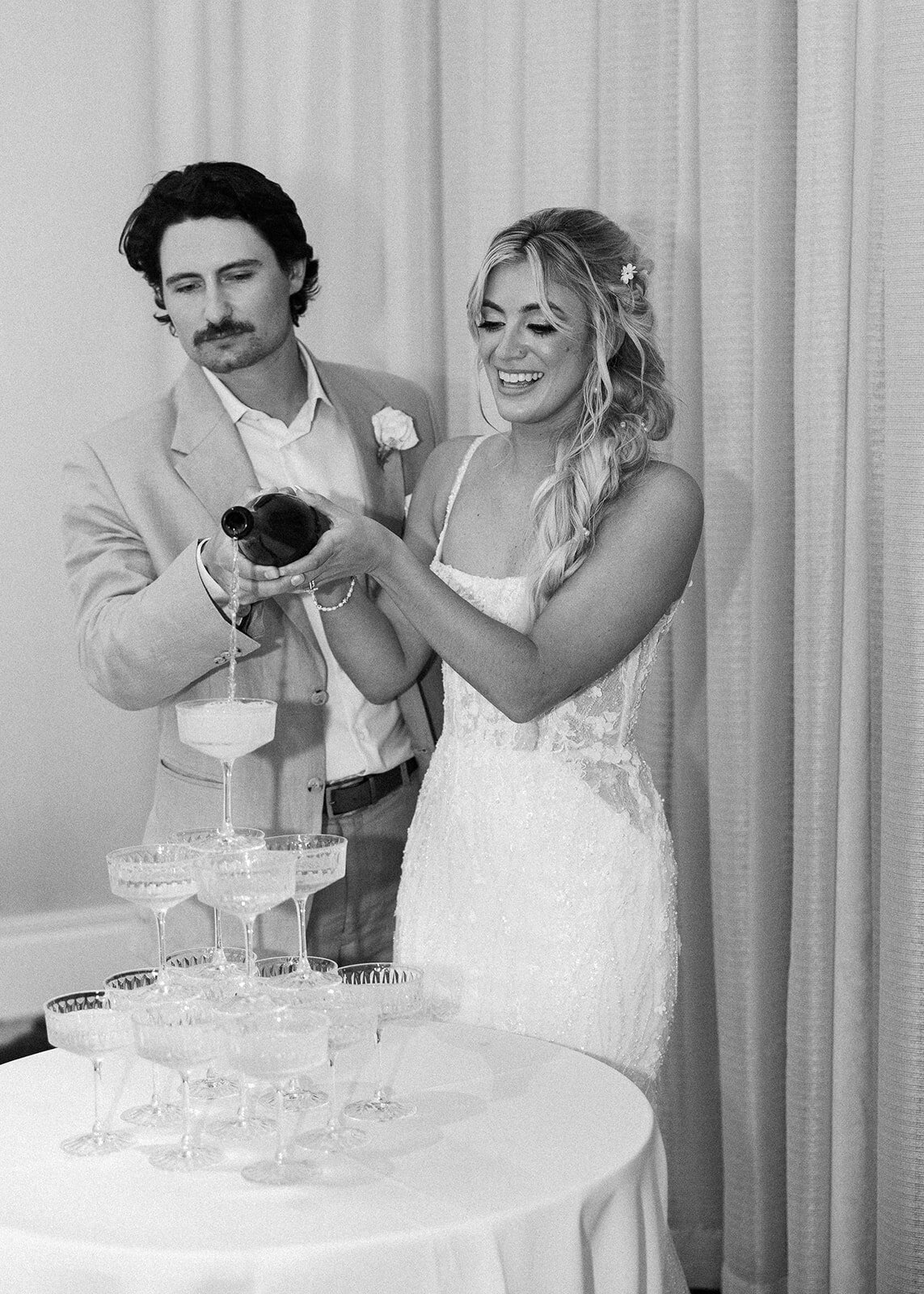 A classic wedding toast moment with a champagne tower at Cheeca Lodge.