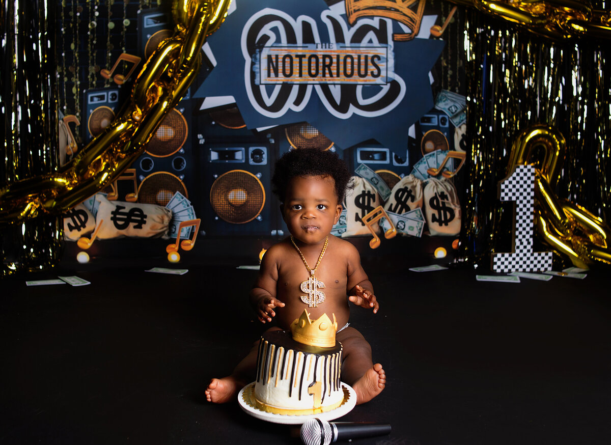 Baby boy, sitting infront of cake during cake smash photoshoot with Franklin, Tennessee family photographer with Franklin, Tennessee photographer