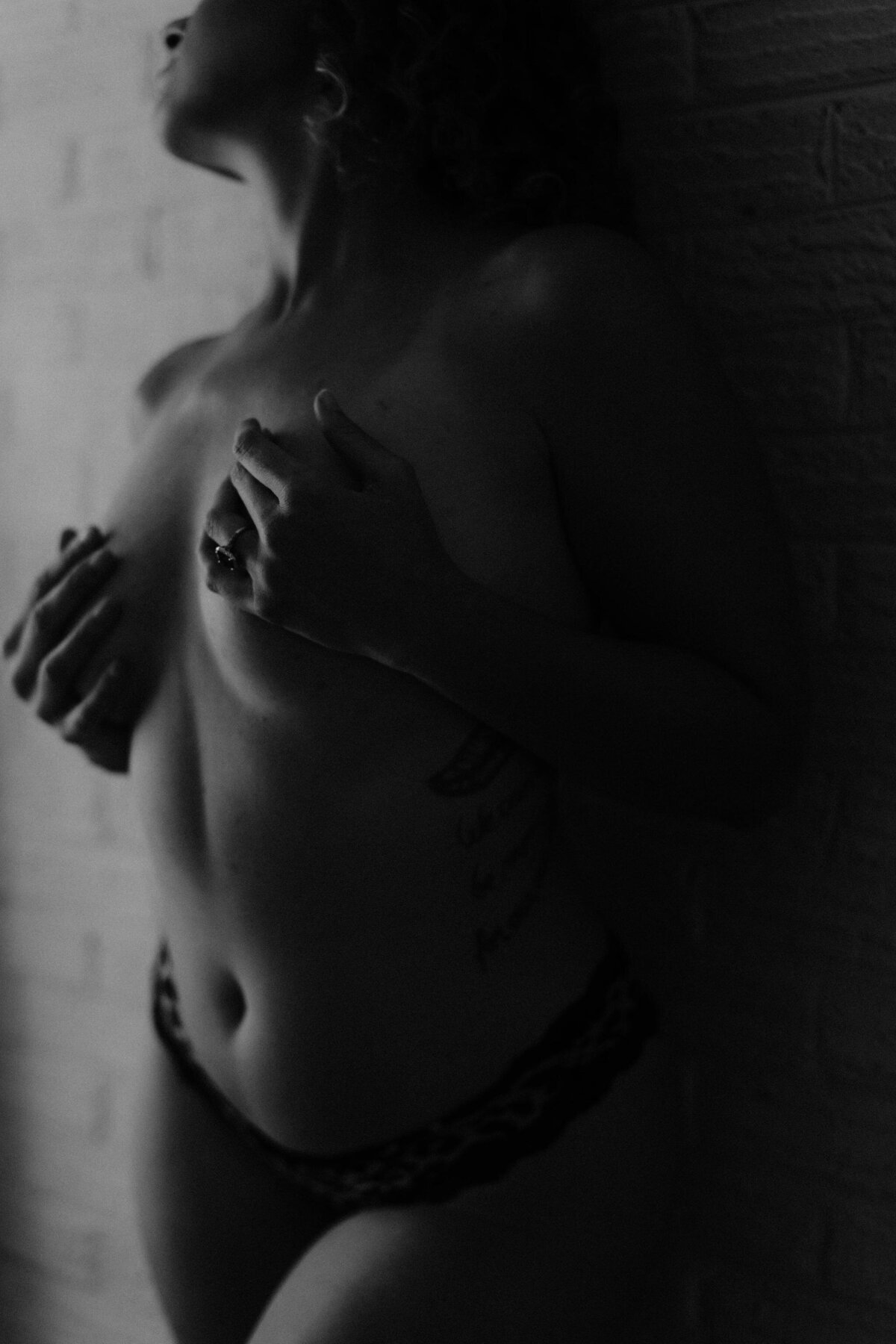 Black and white boudoir portrait taken in Jessica Arden Photography's home studio in Charlotte