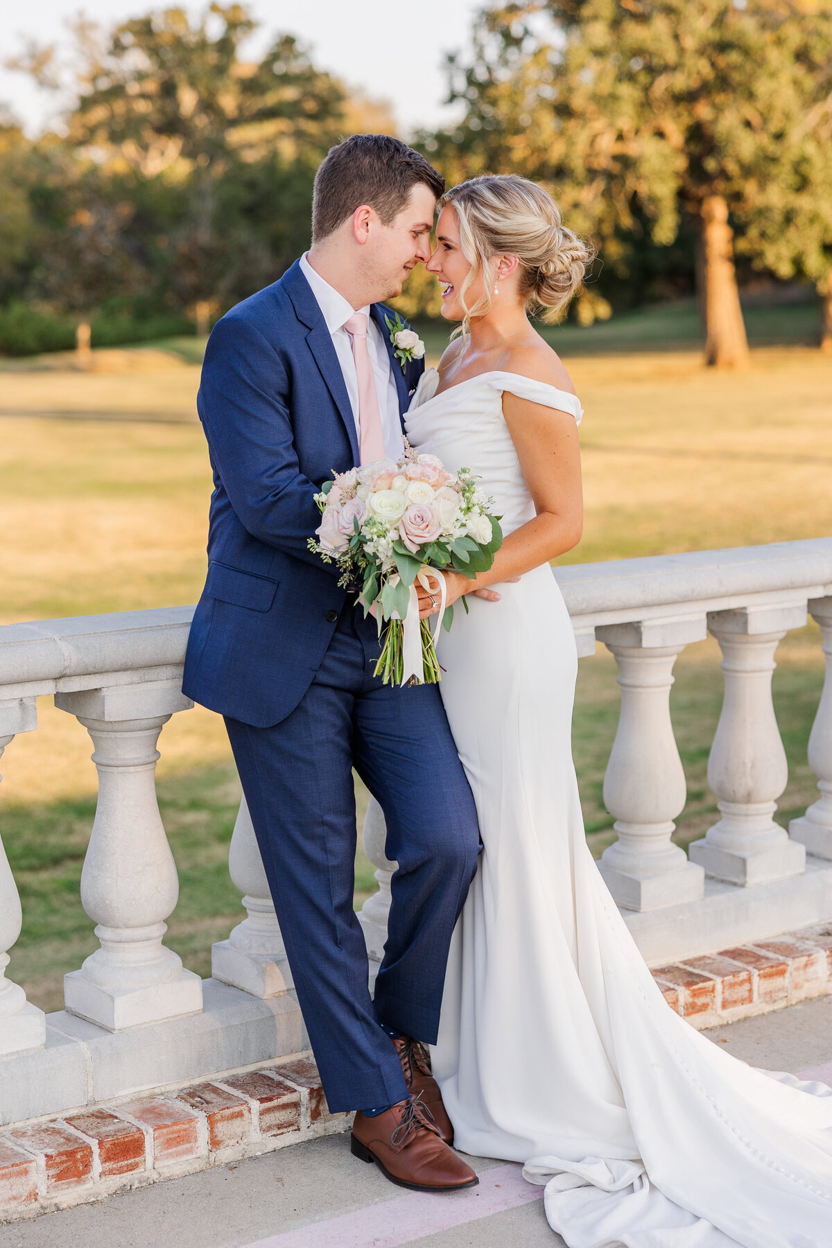 A timeless, light-filled image of a joyful bride and groom captured during golden hour at a grand estate near Highland Village and Coppell. Showcasing romantic, editorial-style wedding photography in the DFW area with a soft, elegant touch.