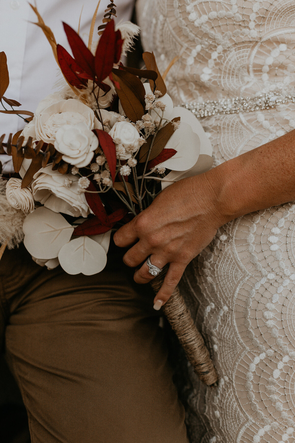 bride holding bouquet - close up with ring