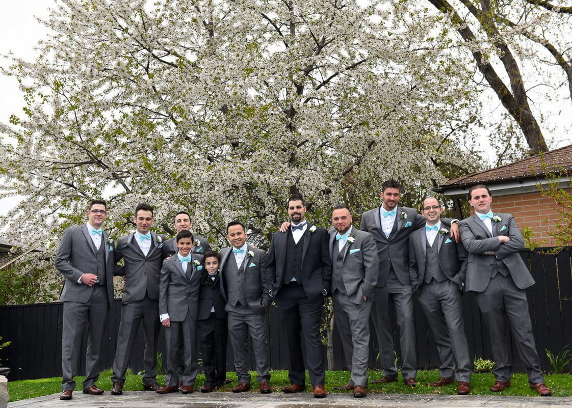 Groom and Groomsmen Posing Outdoors