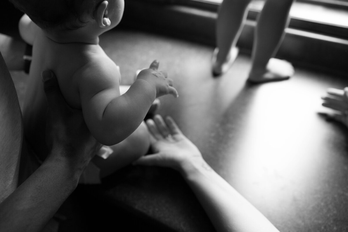 pregnant woman holds belly