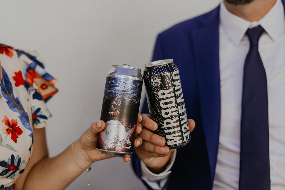bride and groom enjoying their favorite local craft beers together before their ceremony