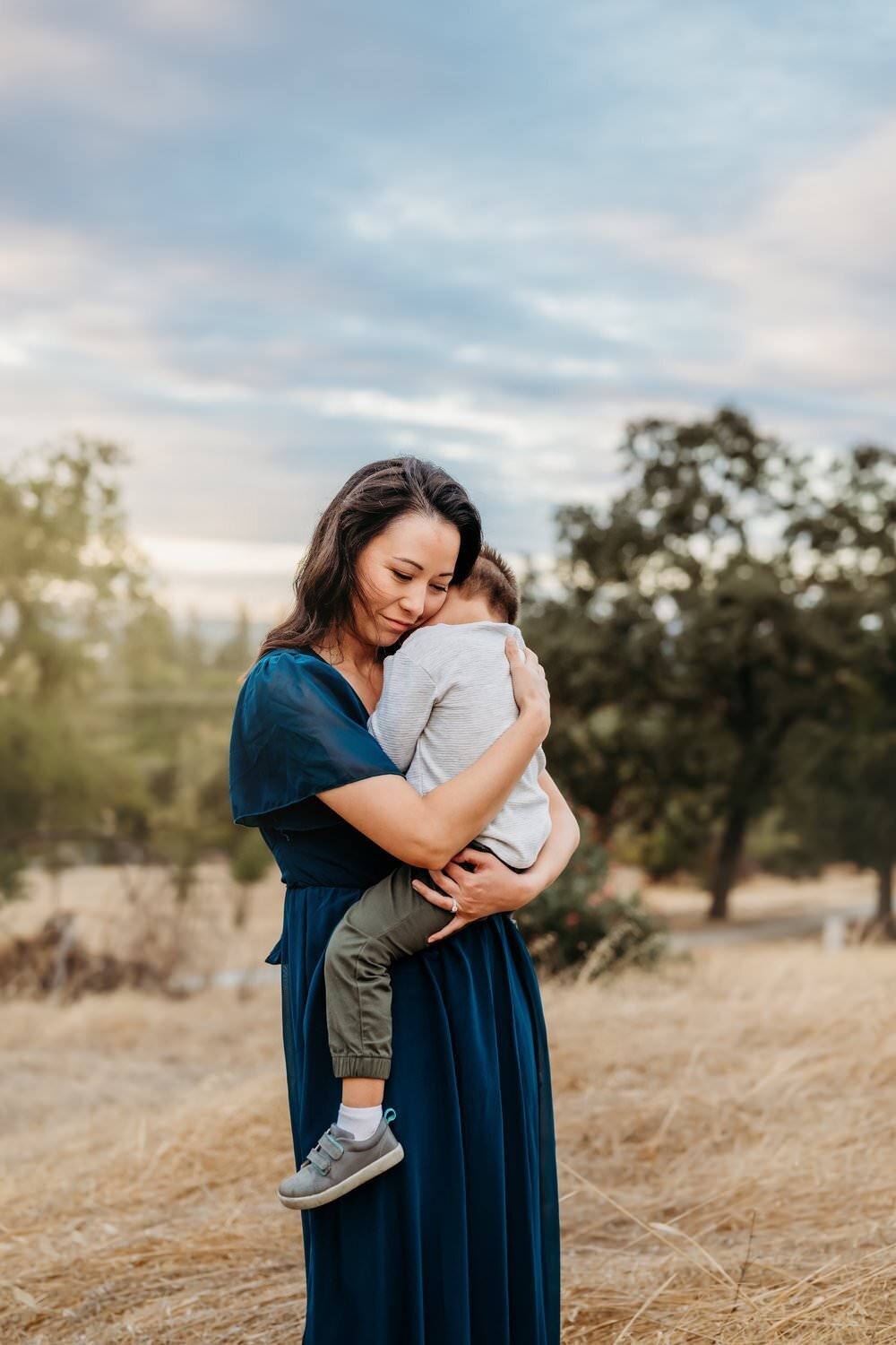 mama-hugging-toddler-windy