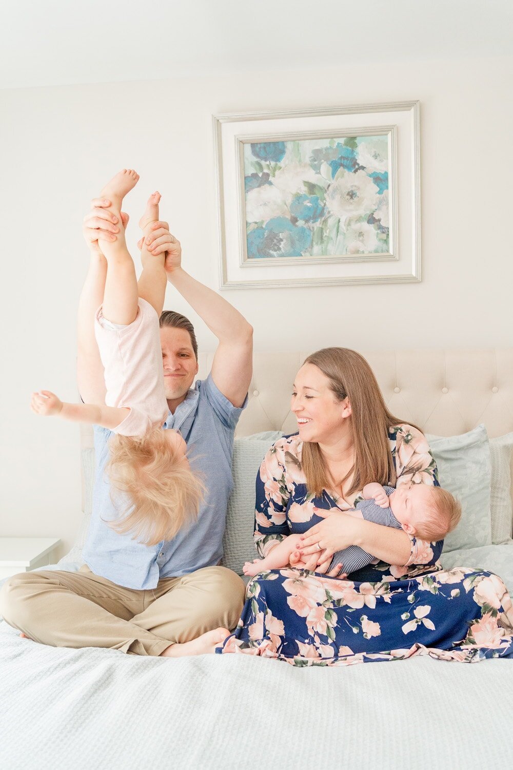 family of 4 playing during in home newborn photography in McLean, Virginia
