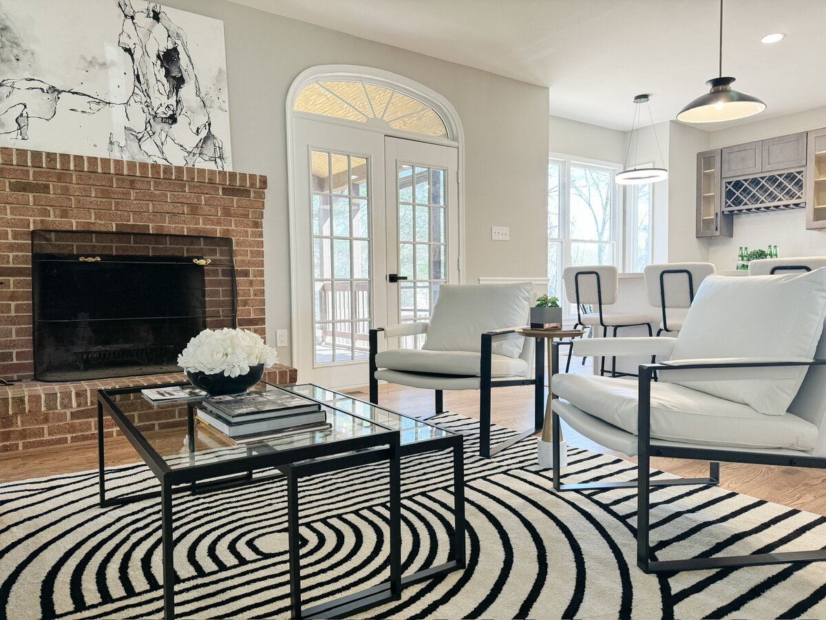 Living room with striped and rug and fireplace