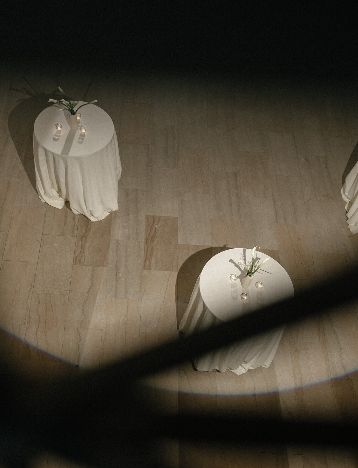 unique view of wedding cocktail table design with calla lilies from above