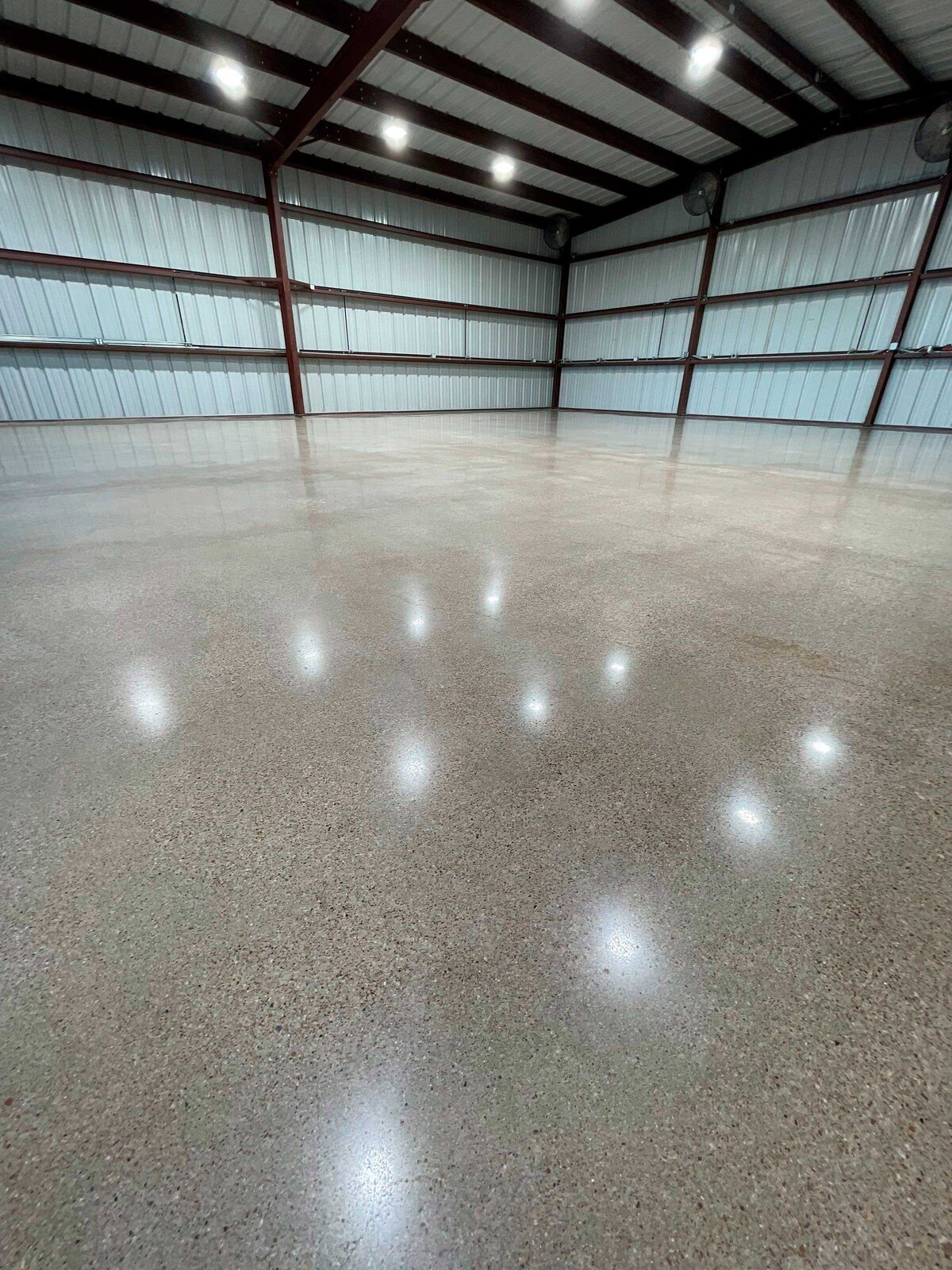 Polished Concrete for Homes in DFW highlighting a beautifully finished concrete floor in a modern residential space with a sleek and glossy finish.
