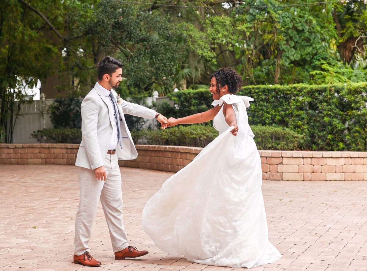 bride and groom dancing in courtyard at Dr Phillips House in Orlando Florida by Orlando Wedding Photographer Amanda Richardson Photography