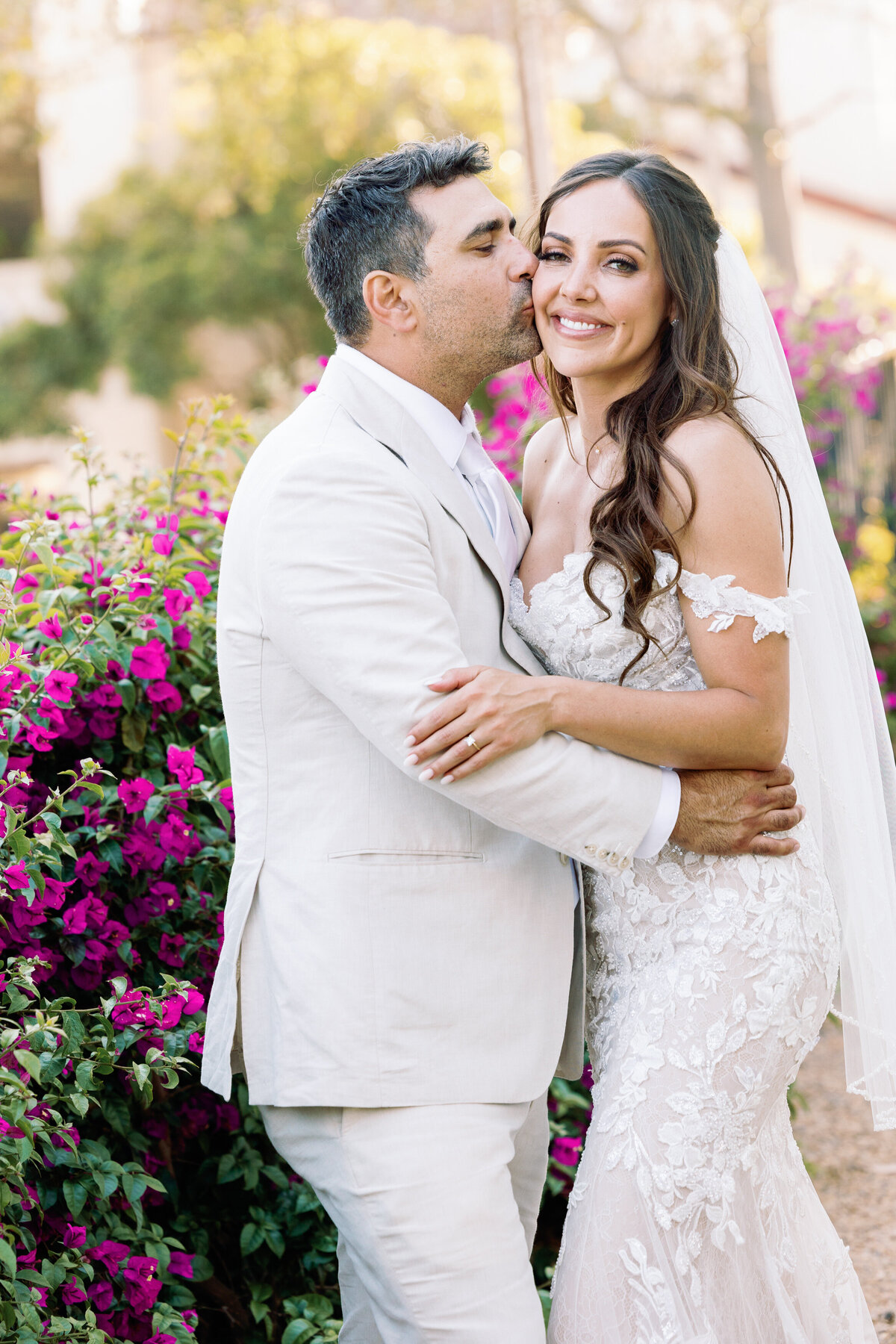 Groom Kissing bride at the Lily Pond