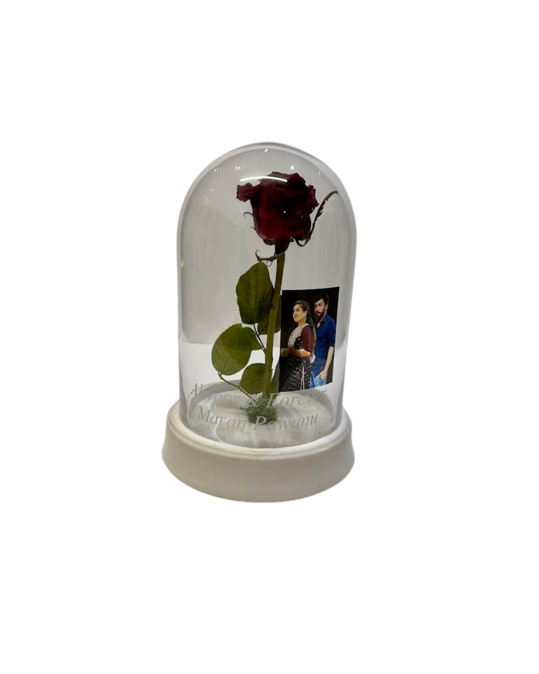 Funeral flowers preserved inside a dome.
