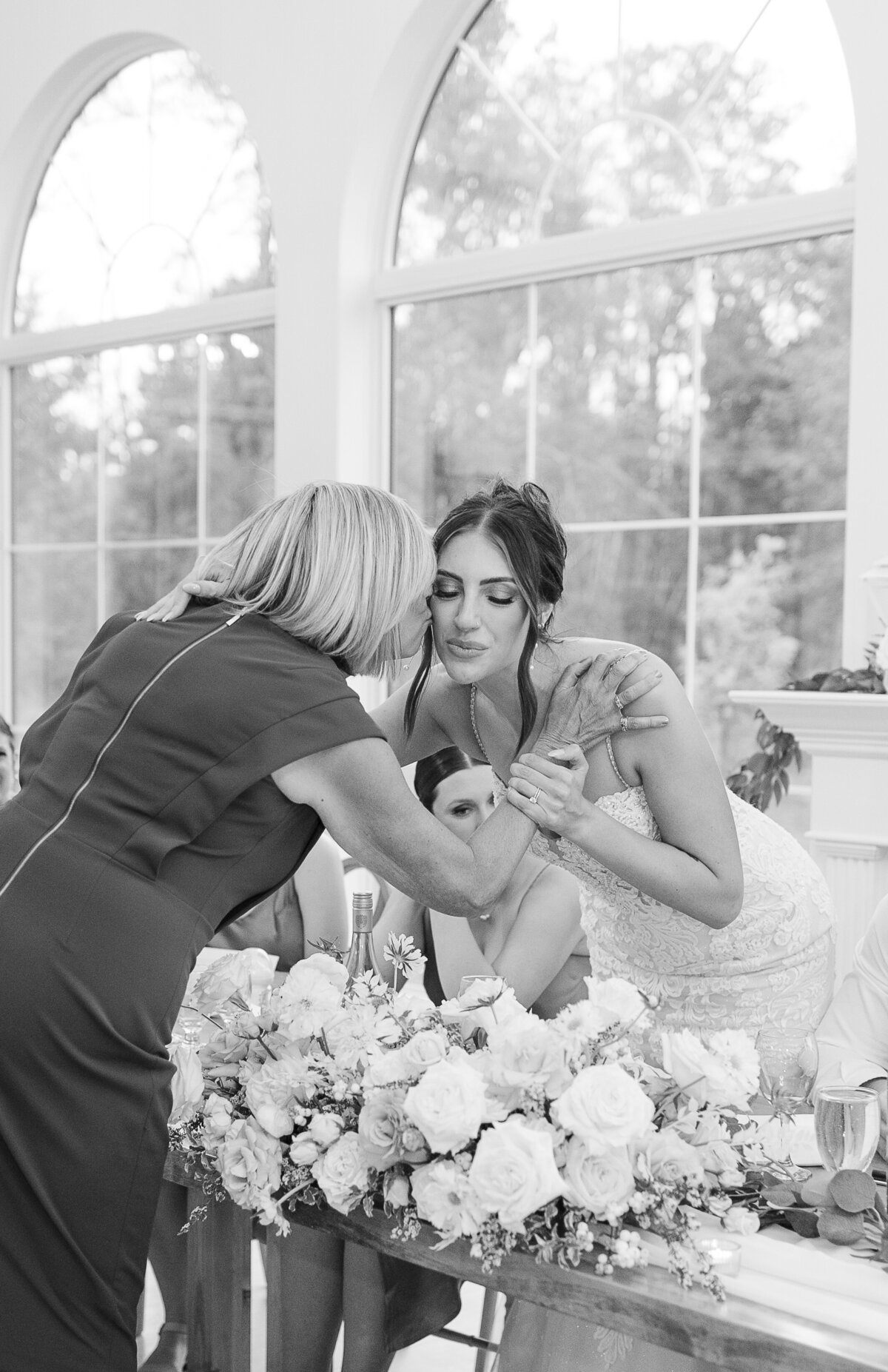 bride kissing mom