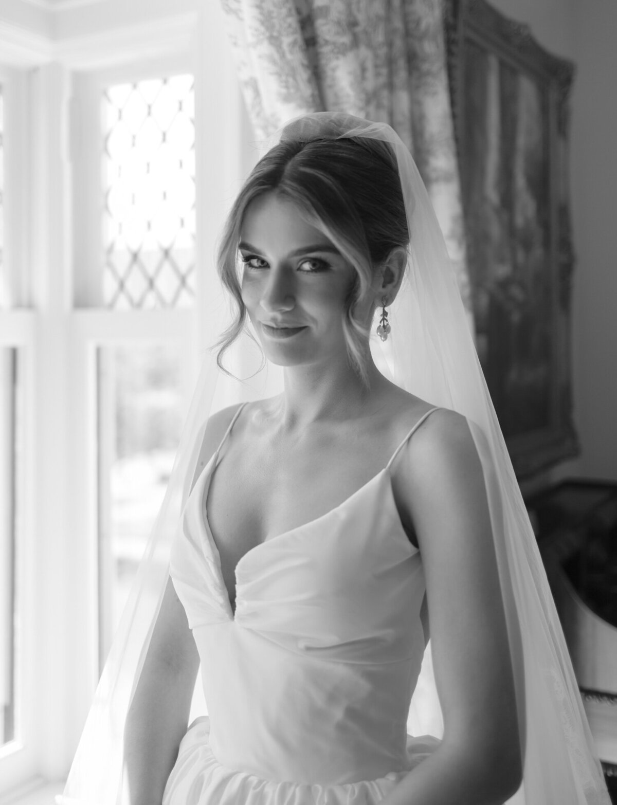 a beautiful bride gazes softly at the camera of Christina Harrison, Detroit, Michigan film wedding photographer