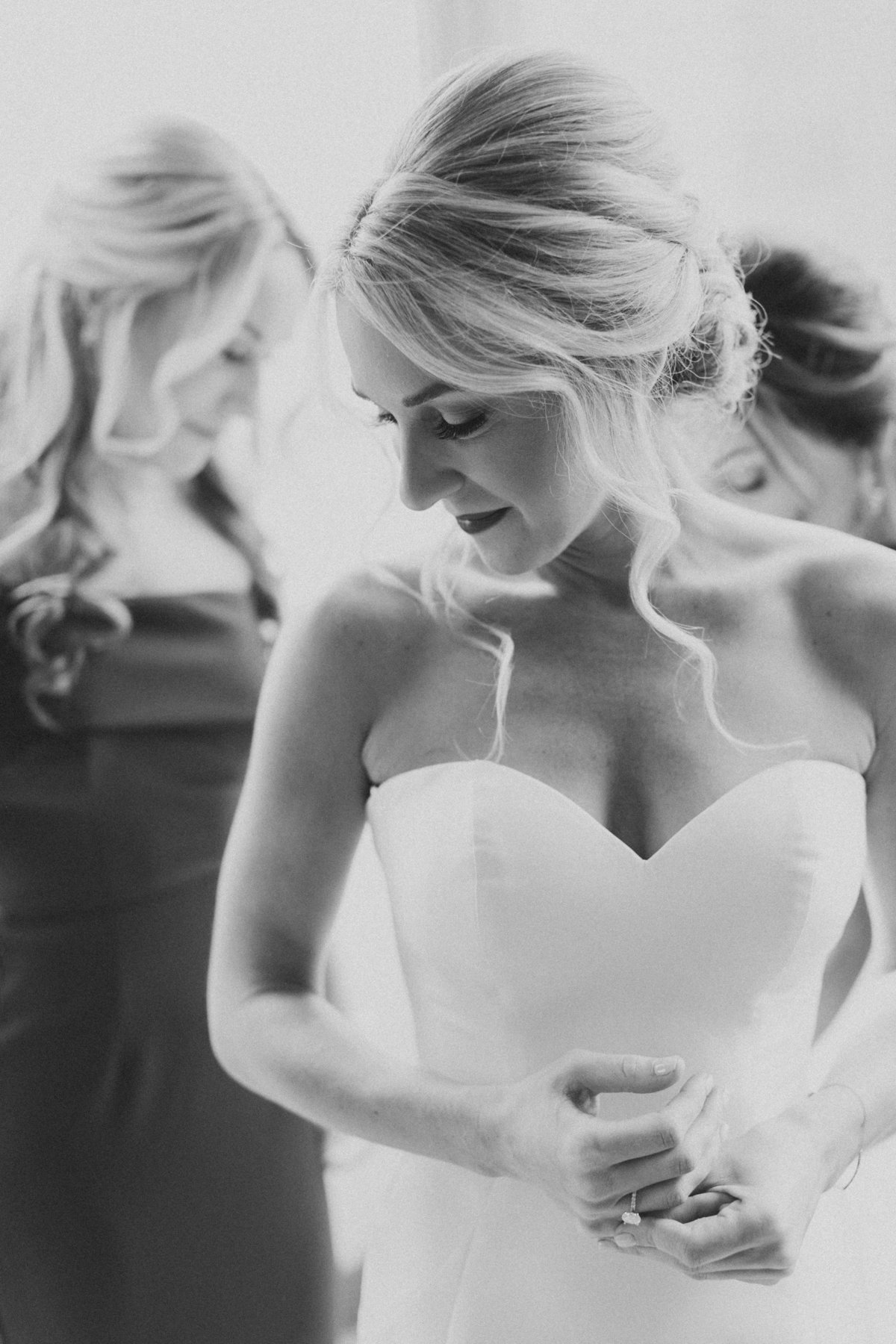 bride looking over shoulder in black and white portrait