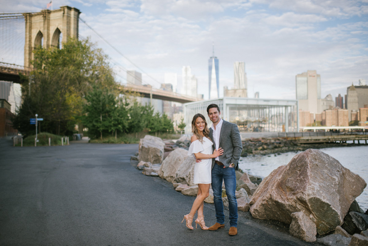 nyc dumbo brooklyn engagement photography happy elegant brooklyn bridge skyline
