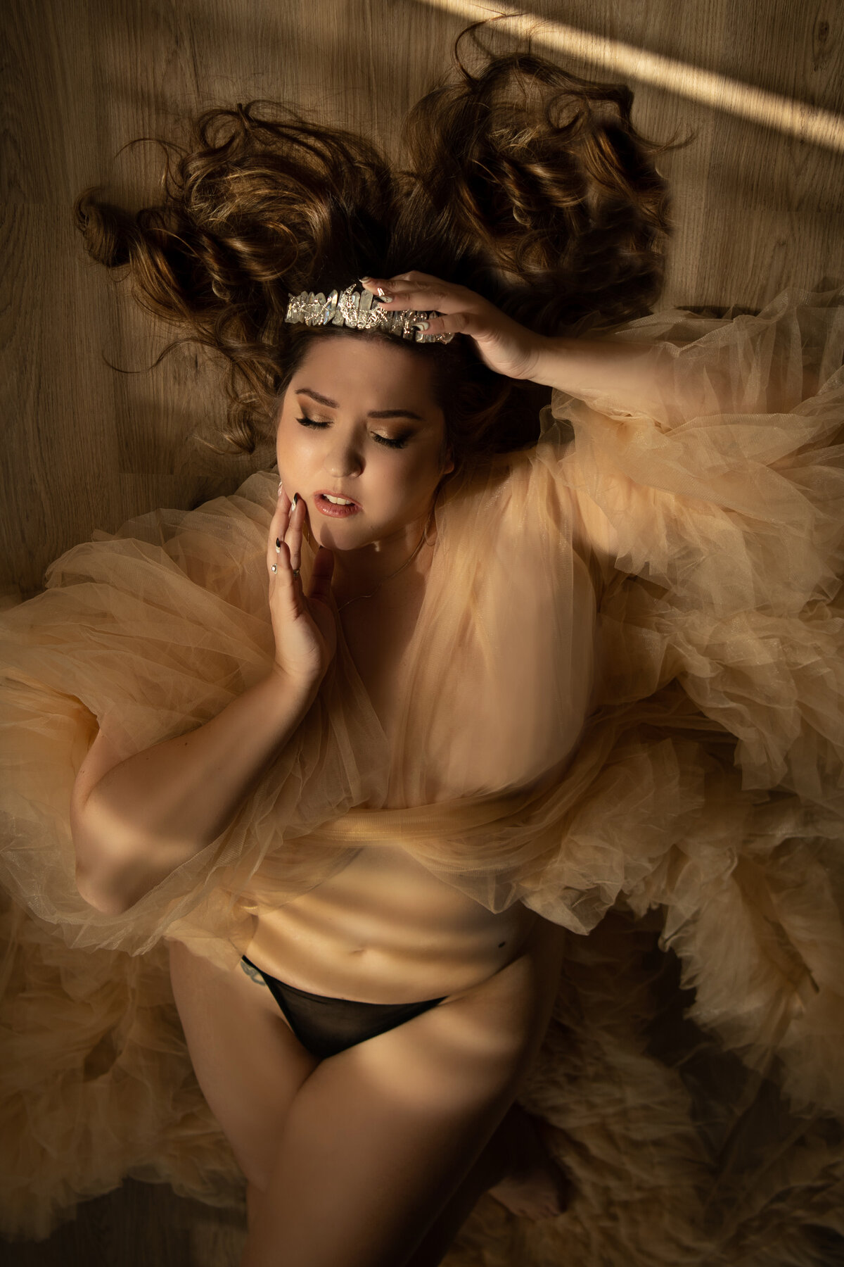 Woman wearing tiara in boudoir vancouver studio