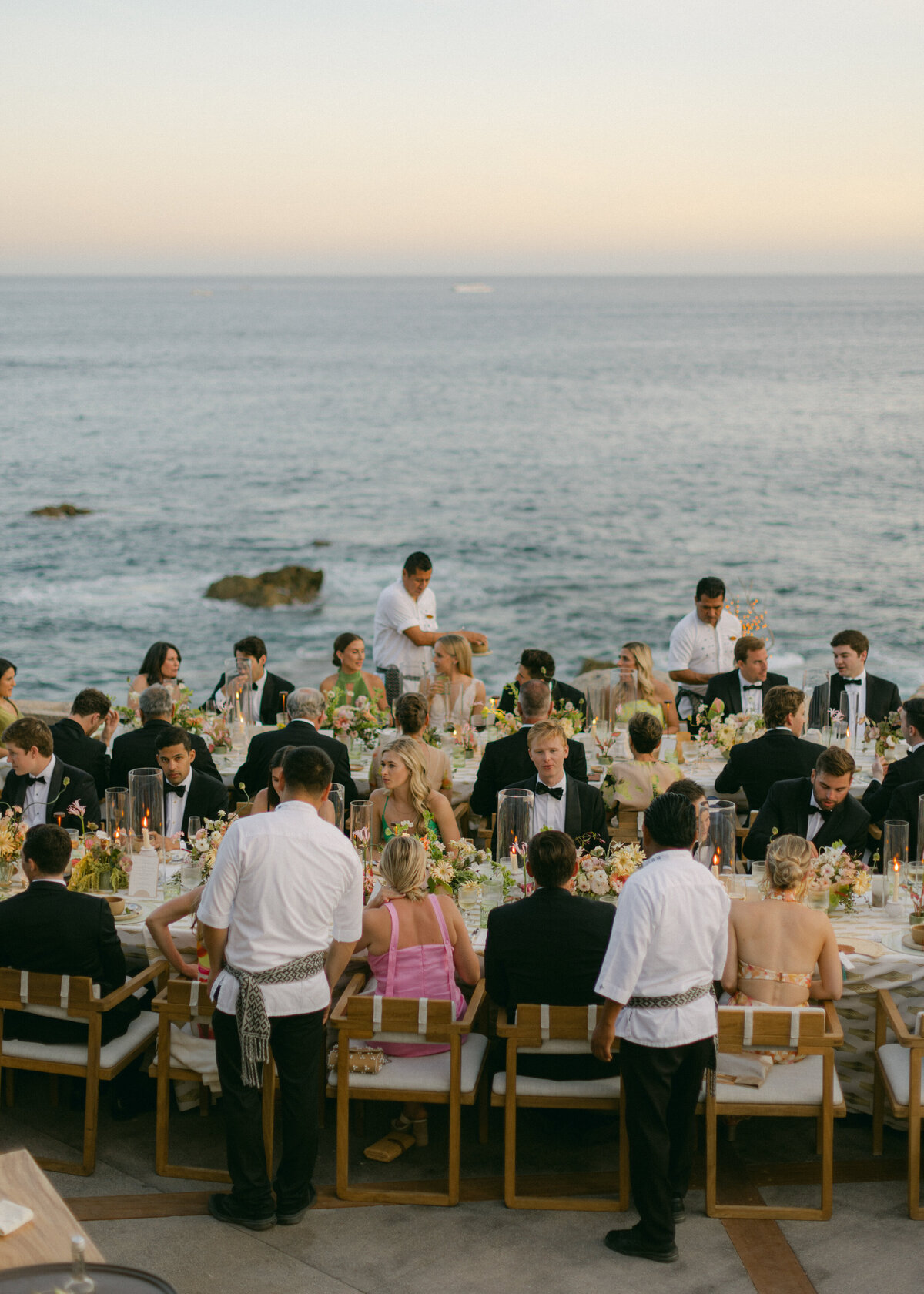 caterers serving wedding guests beachside