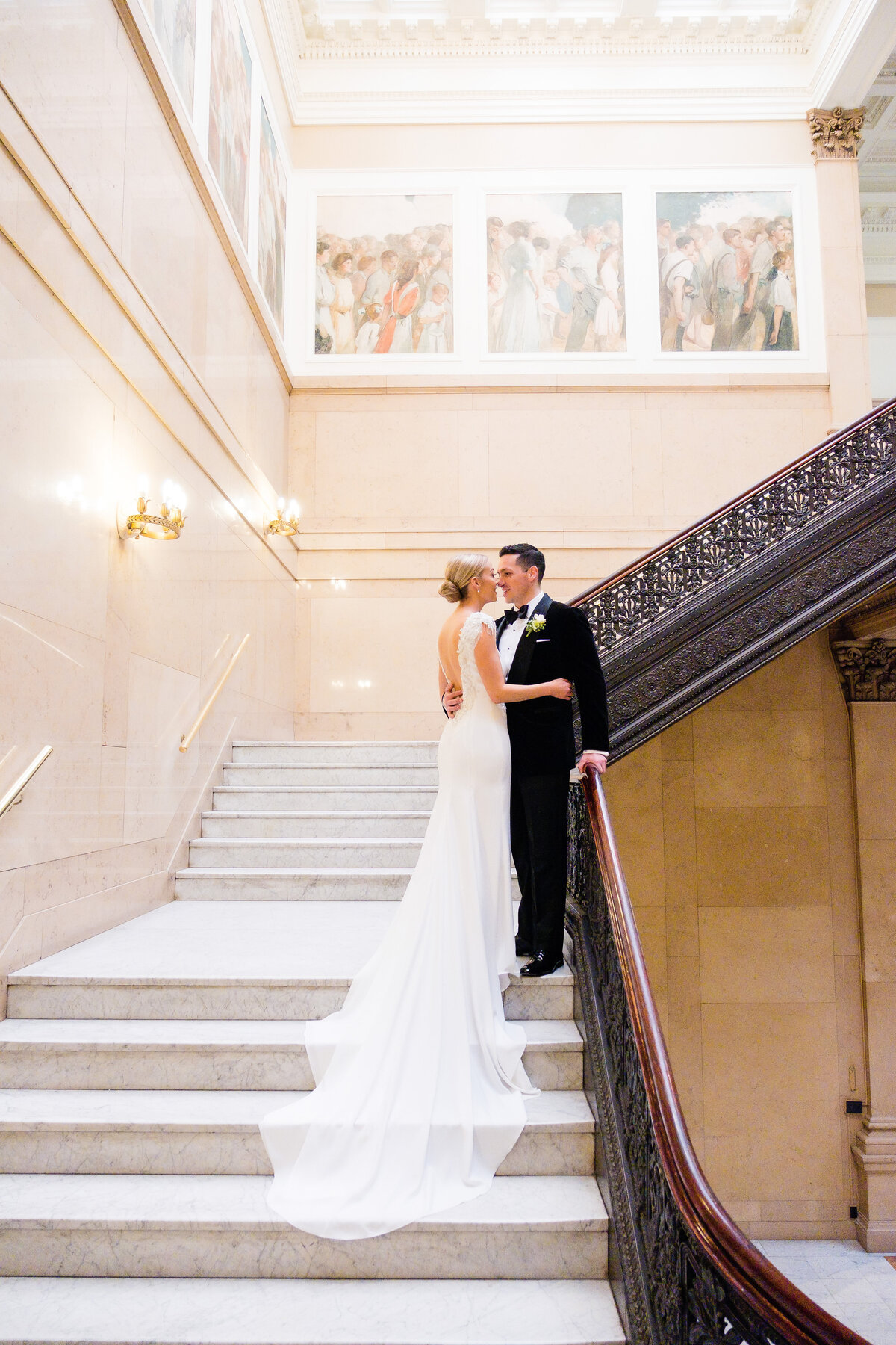 wedding photo on staircases in carnegie museum