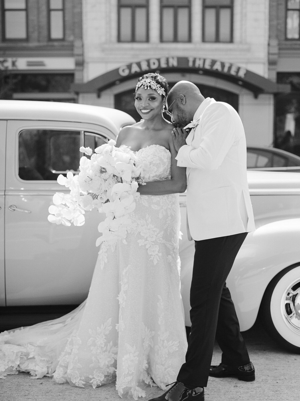 candid wedding photography, black bride and groom with vintage wedding car in Detroit