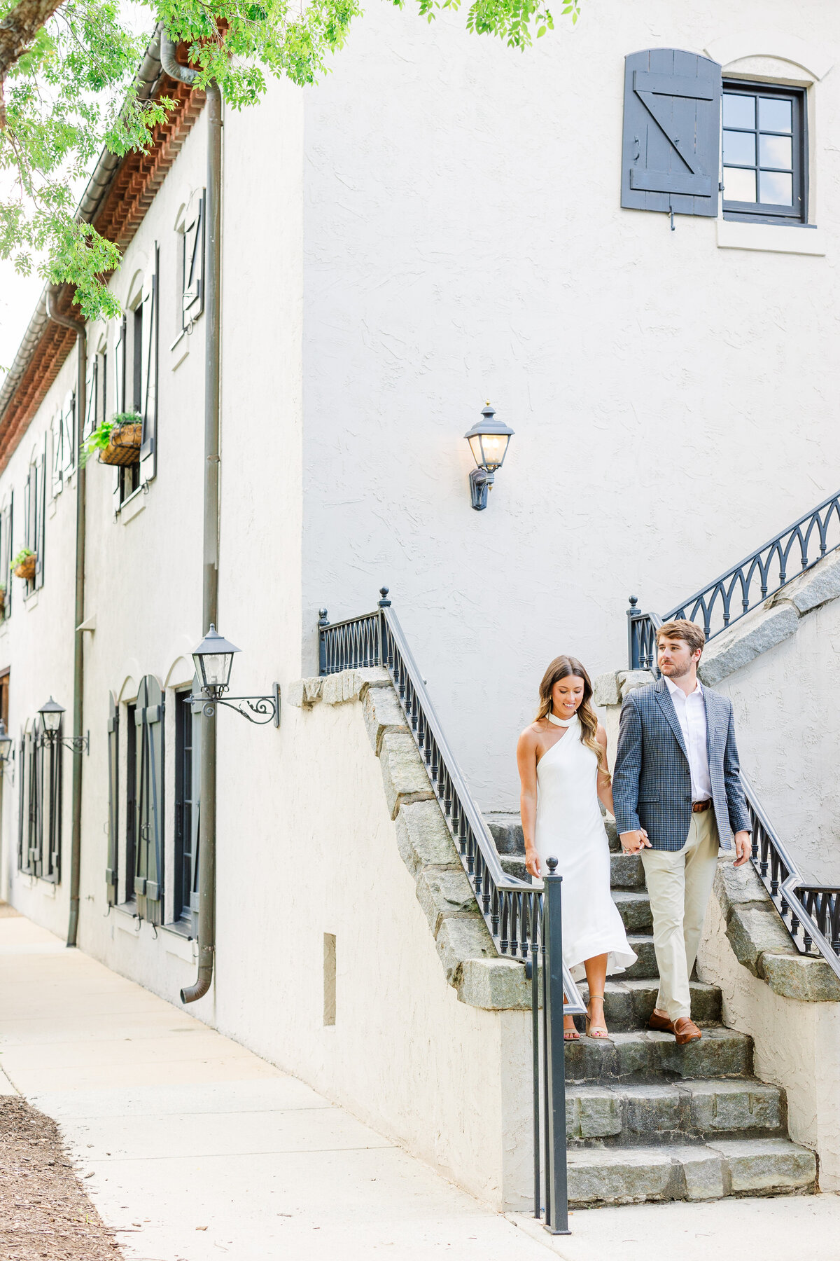couple walking down stairs at hotel domestique