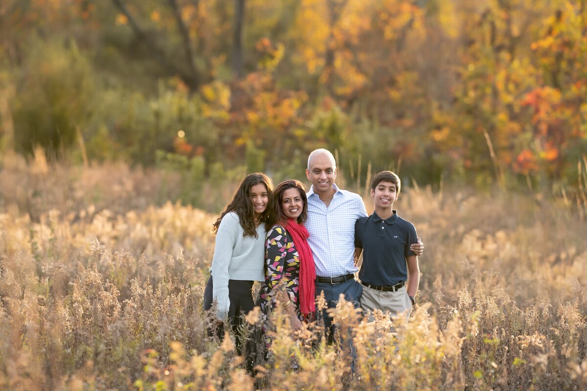 family in field smiling