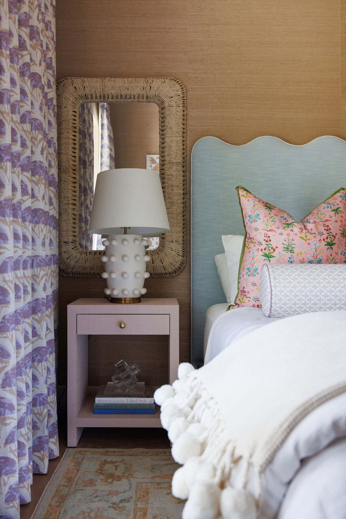 oyster creek studios aryns home pink bedside table and purple patterned curtains with light blue bed
