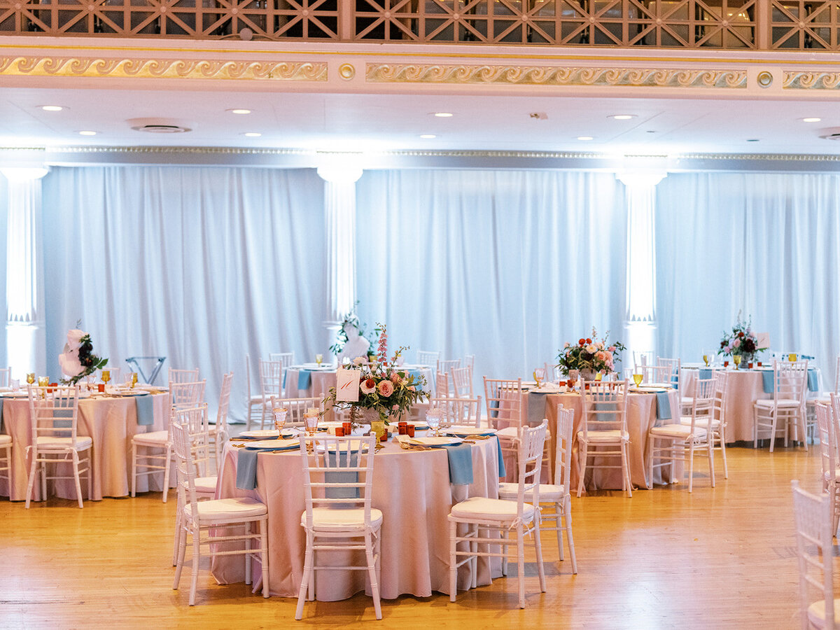 This romantic summer solstice wedding held at the elegant War Memorial was filled with pops of cherry red, pink and white flowers and lush greenery. Floral Design by Rosemary and Finch in Nashville, TN.