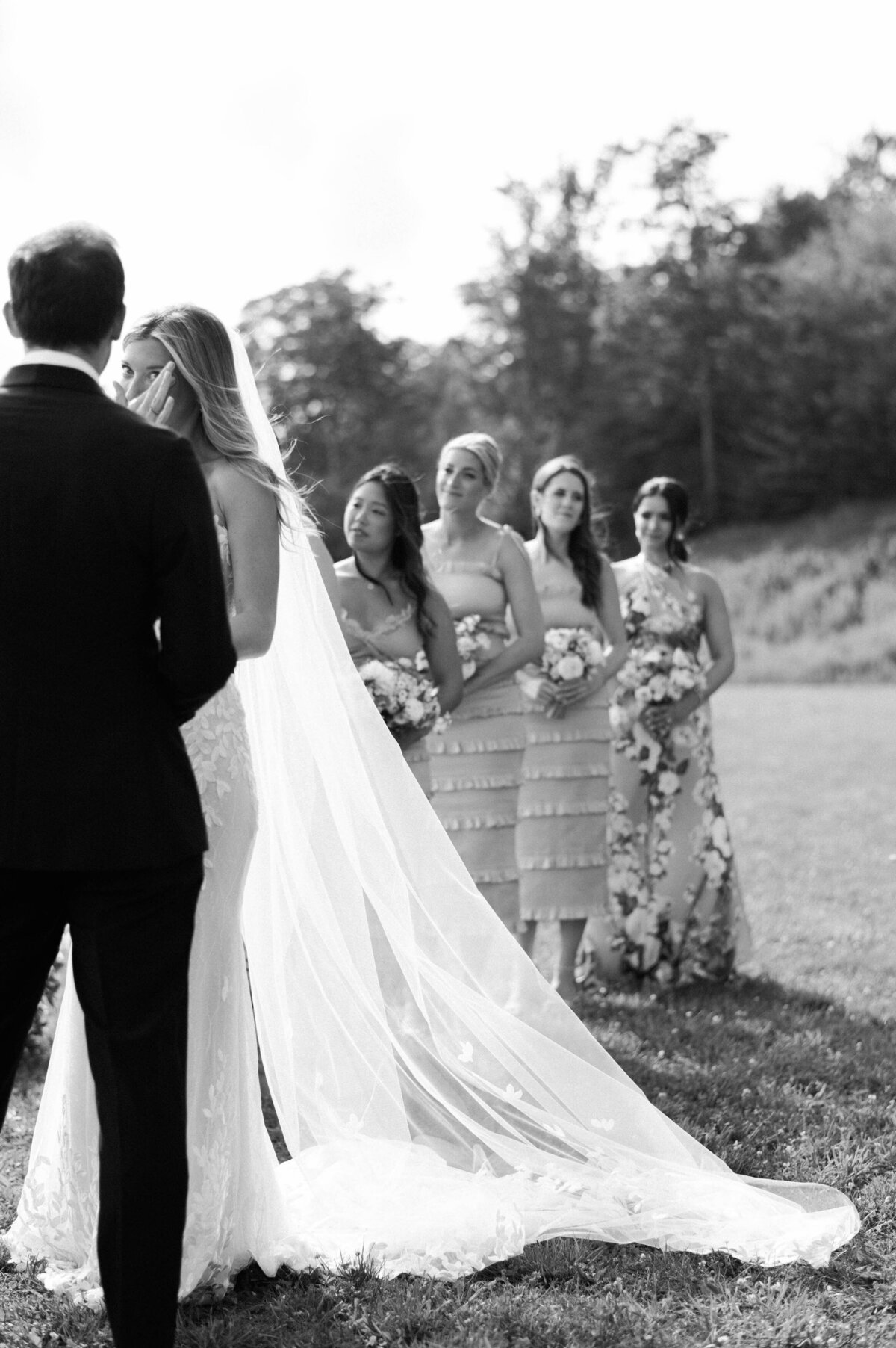 Bridesmaids standing at the altar listening to vows