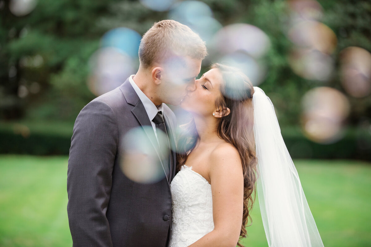 photo of bride and groom kissing outdoors from wedding at The Carltun