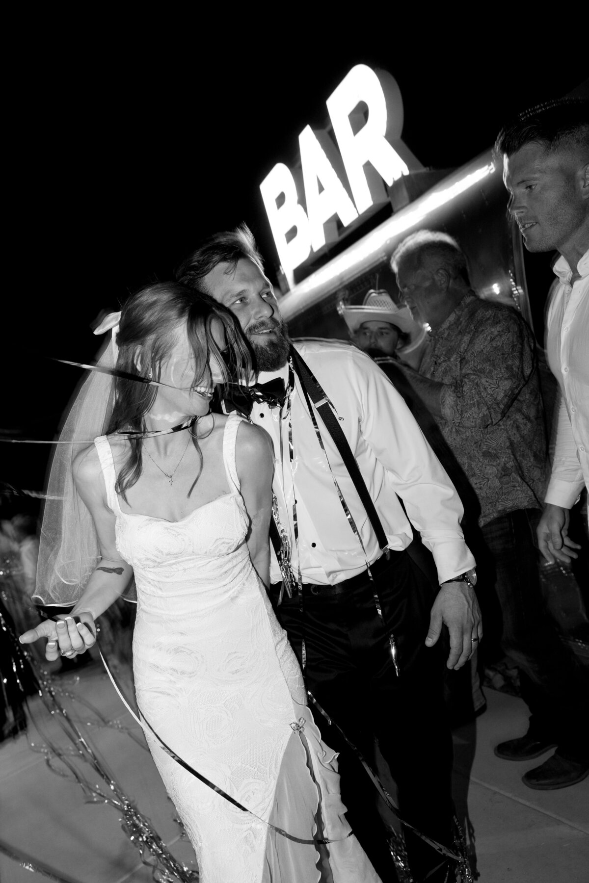 A bride and groom exit their wedding reception in downtown Austin.