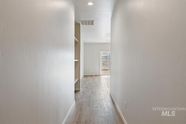 interior hallway of home with painted white walls