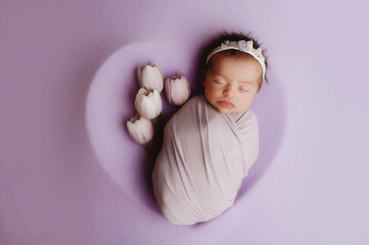 Infant posed for Newborn Photos in Charleston, SC.